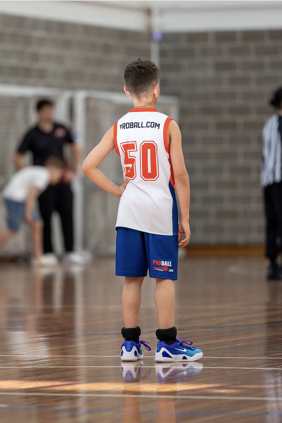 ProBall basketball player competing with their teams during finals, supporting teammates and enjoying the game while representing the hard work, growth, teamwork and friendships built throughout the season.